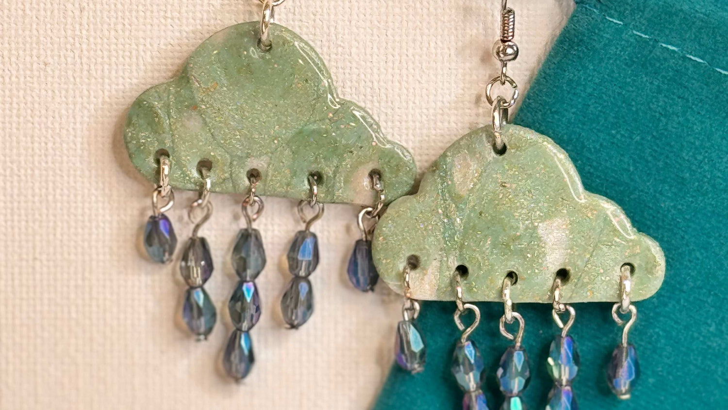 Turquoise Rain Clouds with Saphire Blue Teardrop Glass Beads Resembling Rain Drops in Staggered Tiers with Turquoise Pouch