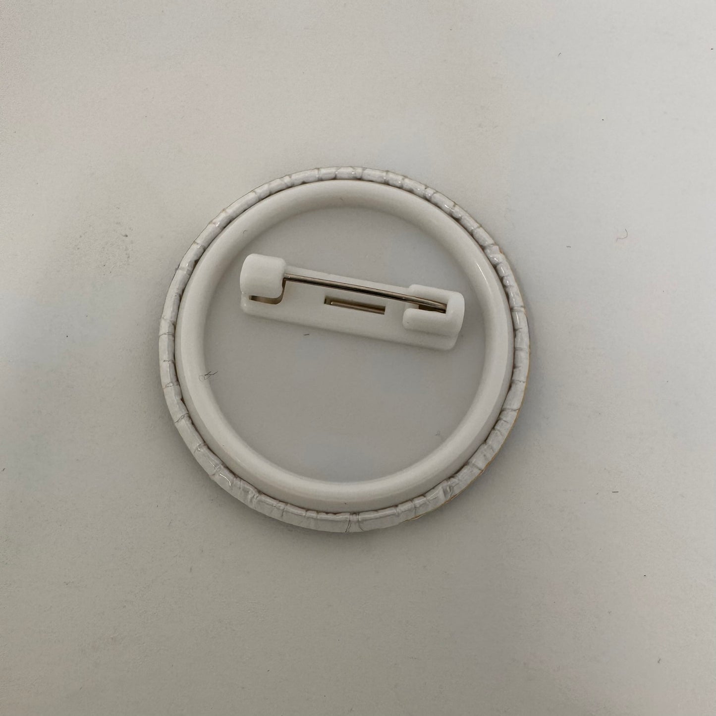 Back of button showing the metal fastener
