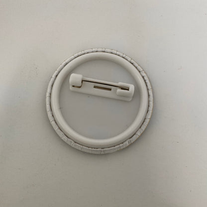 Back of button showing the metal fastener