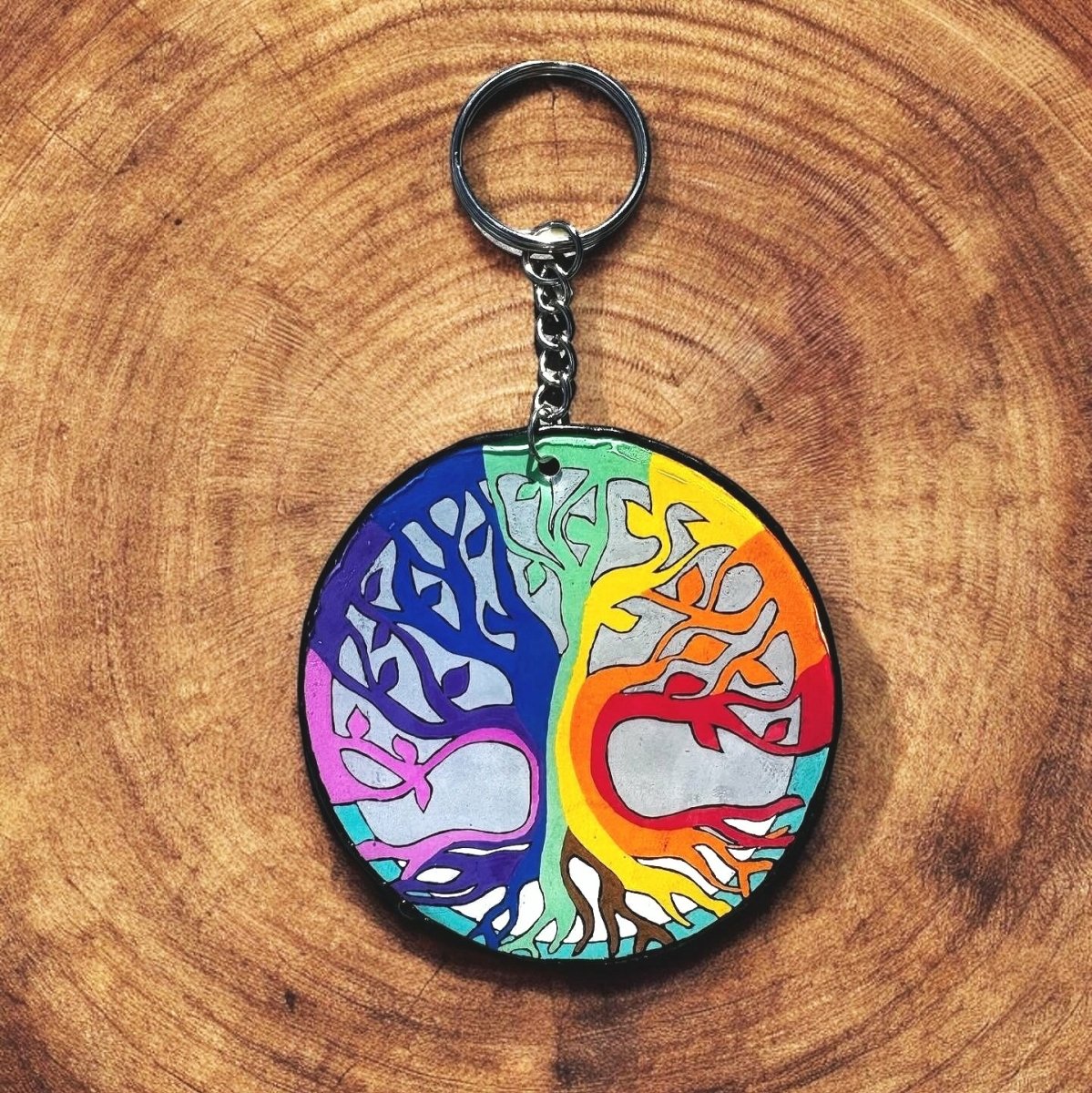 Tree design with rainbow colors in each of the branches. Circular design.