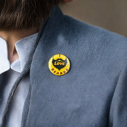 Round button saying I Love Beards. I and Beards are colored in red and the word love in the middle is colored in orange, all with a yellow background.