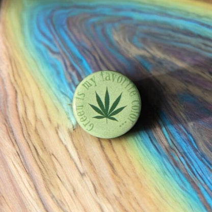 Round button saying green is my favorite color with a green marijuana leaf in the center.