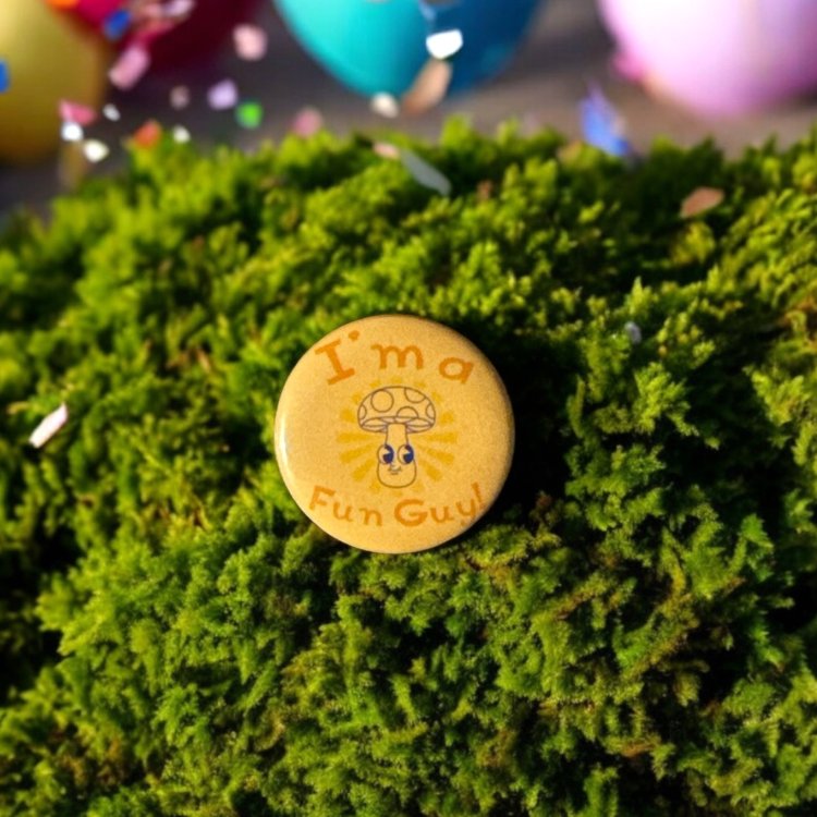Round button saying I'm a fun guy. Sitting in the center is a smiling mushroom in blue.